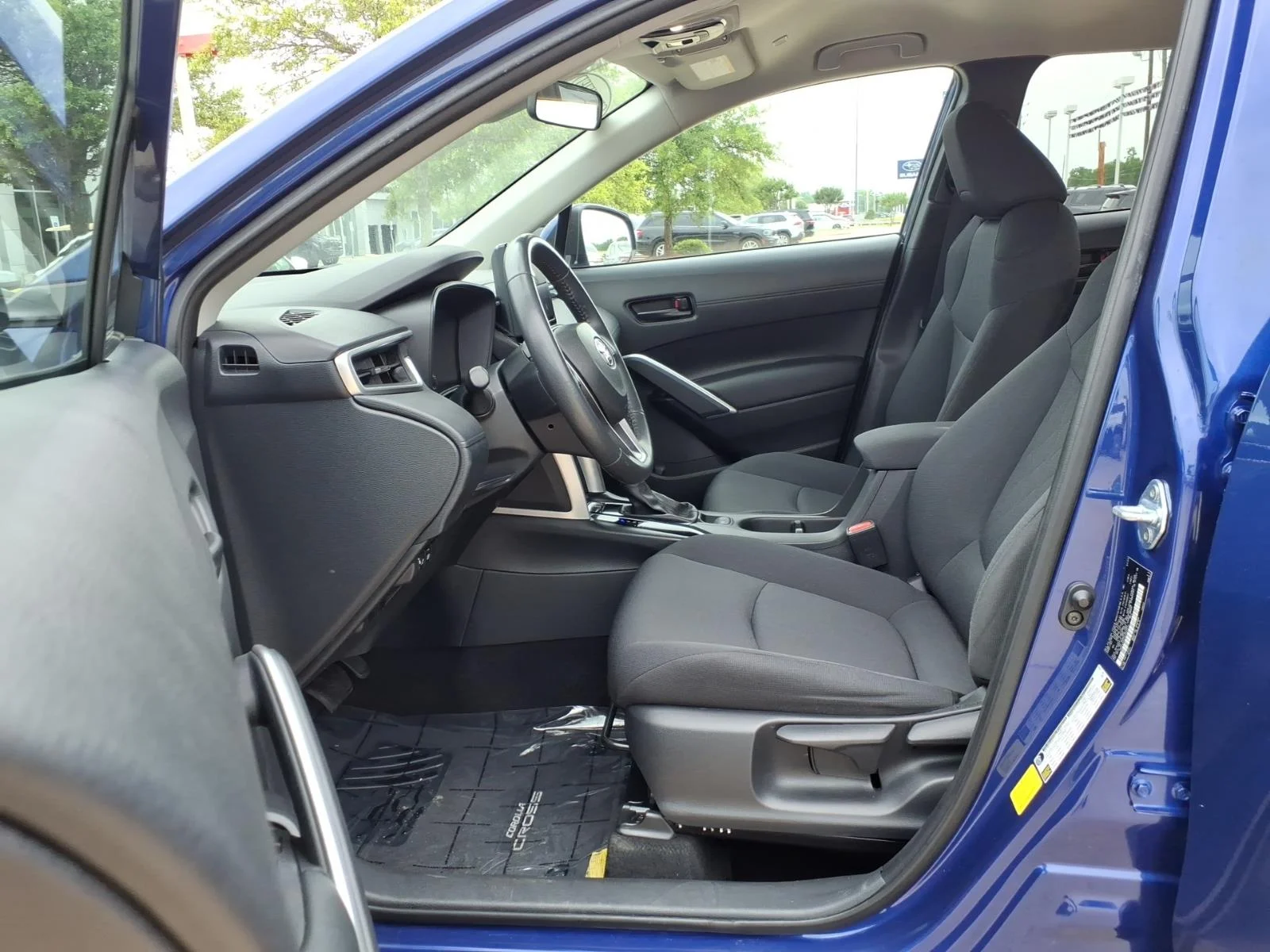 Used 2024 Blue Crush Metallic Toyota LE image 14