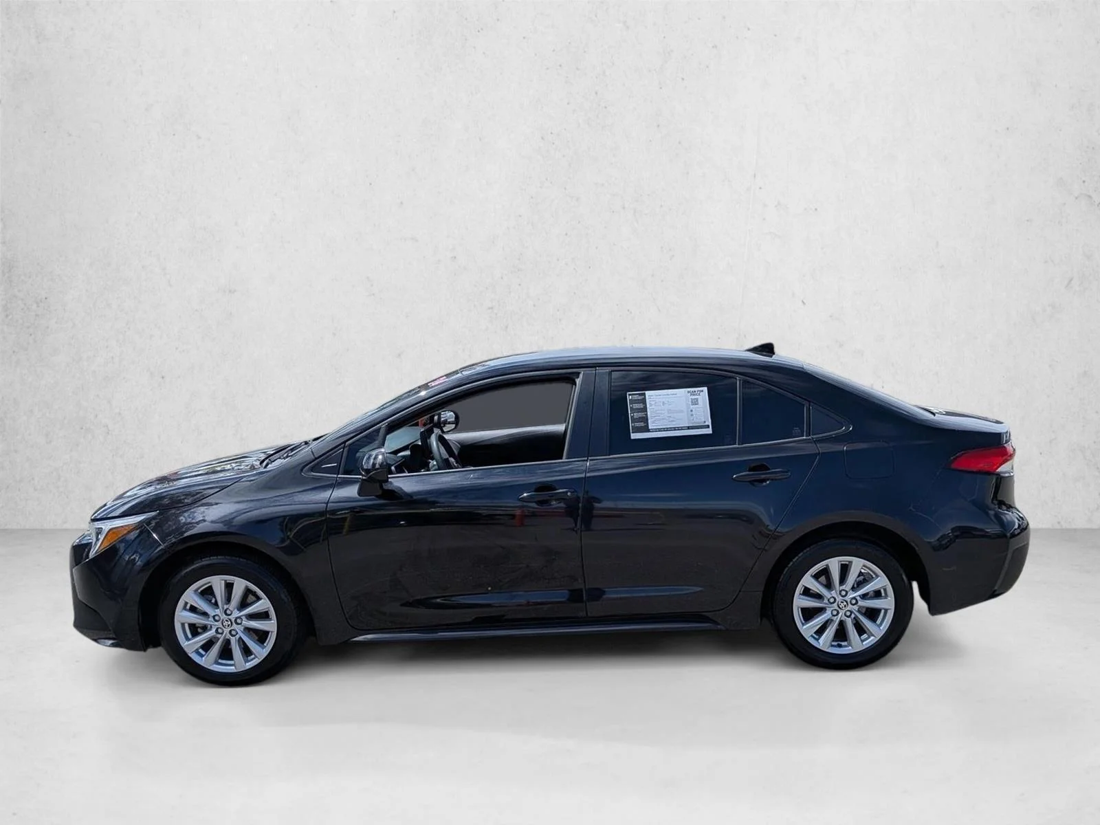 Used 2024 Midnight Black Metallic Toyota Hybrid LE image 9