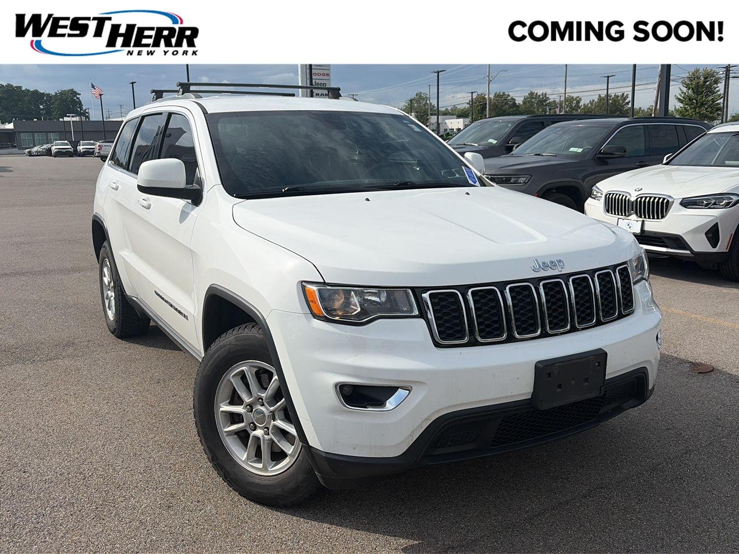 Used 2019 Bright White Clearcoat Jeep Laredo E image 1
