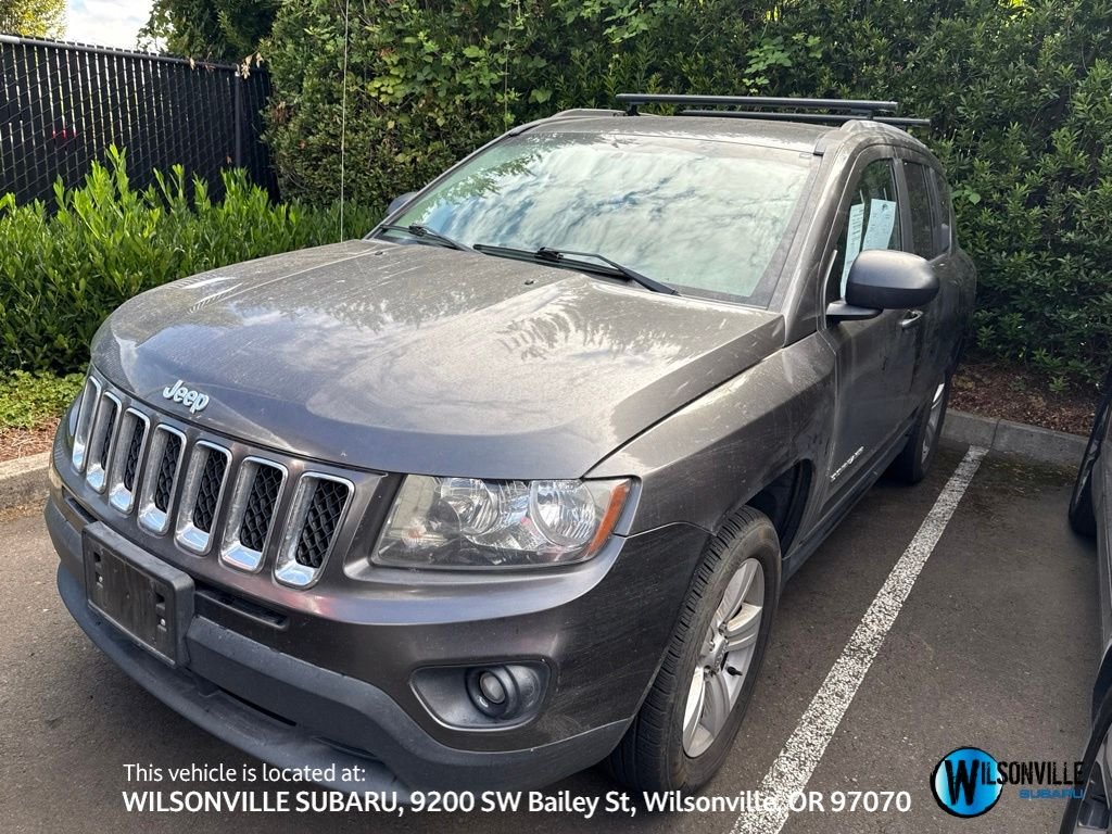 Used 2016 Gray Jeep Sport image 1