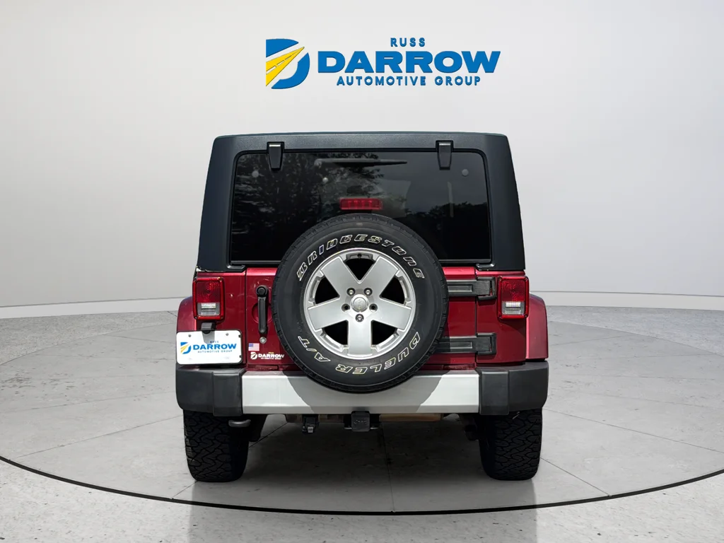 Used 2012 Red Jeep Unlimited Sahara image 4