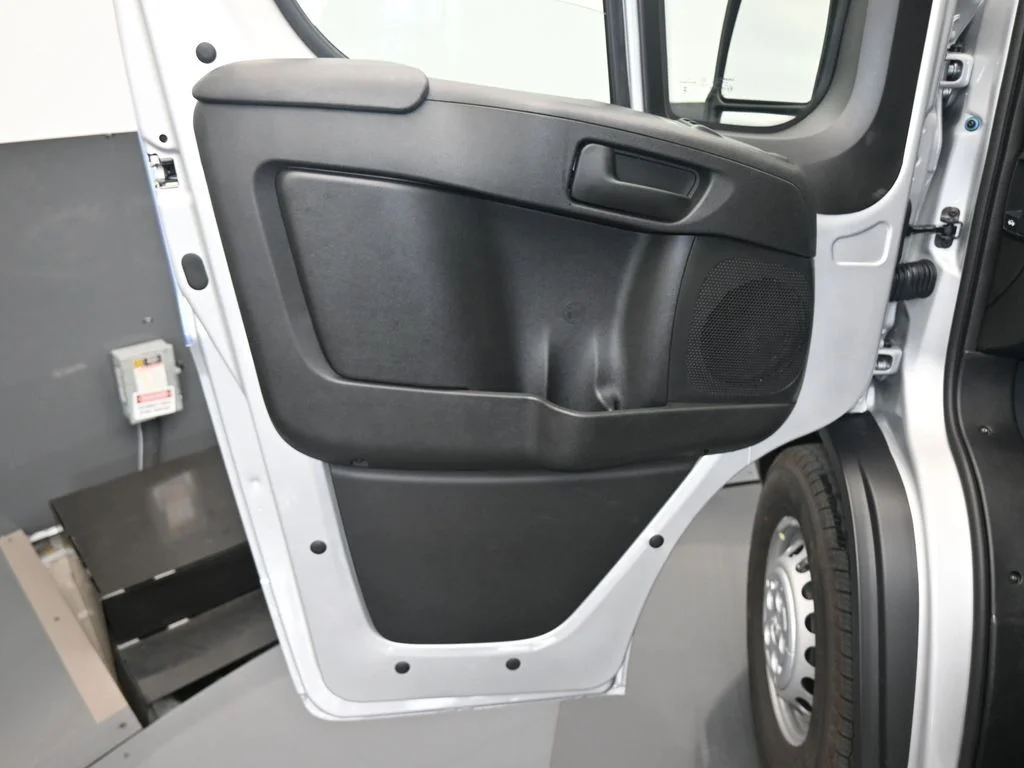 Used 2025 Bright Silver Clearcoat Metallic Ram Low Roof image 11