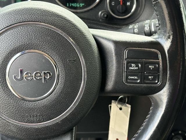 Used 2015 Orange Jeep Sahara image 22