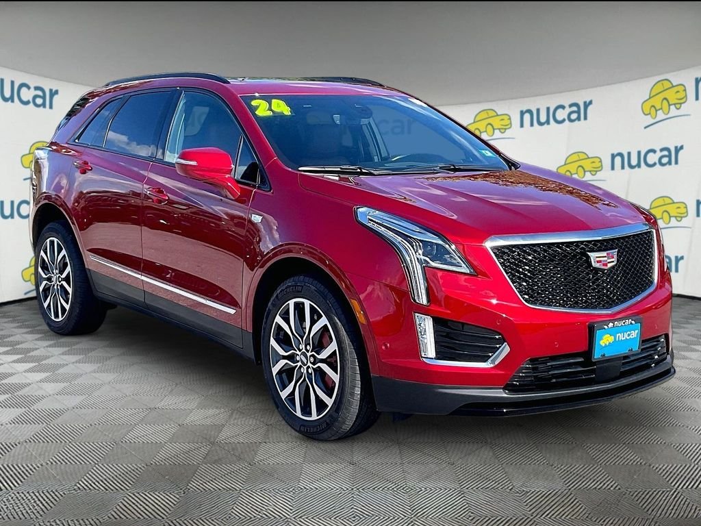 Used 2024 Radiant Red Tintcoat Cadillac Sport image 1