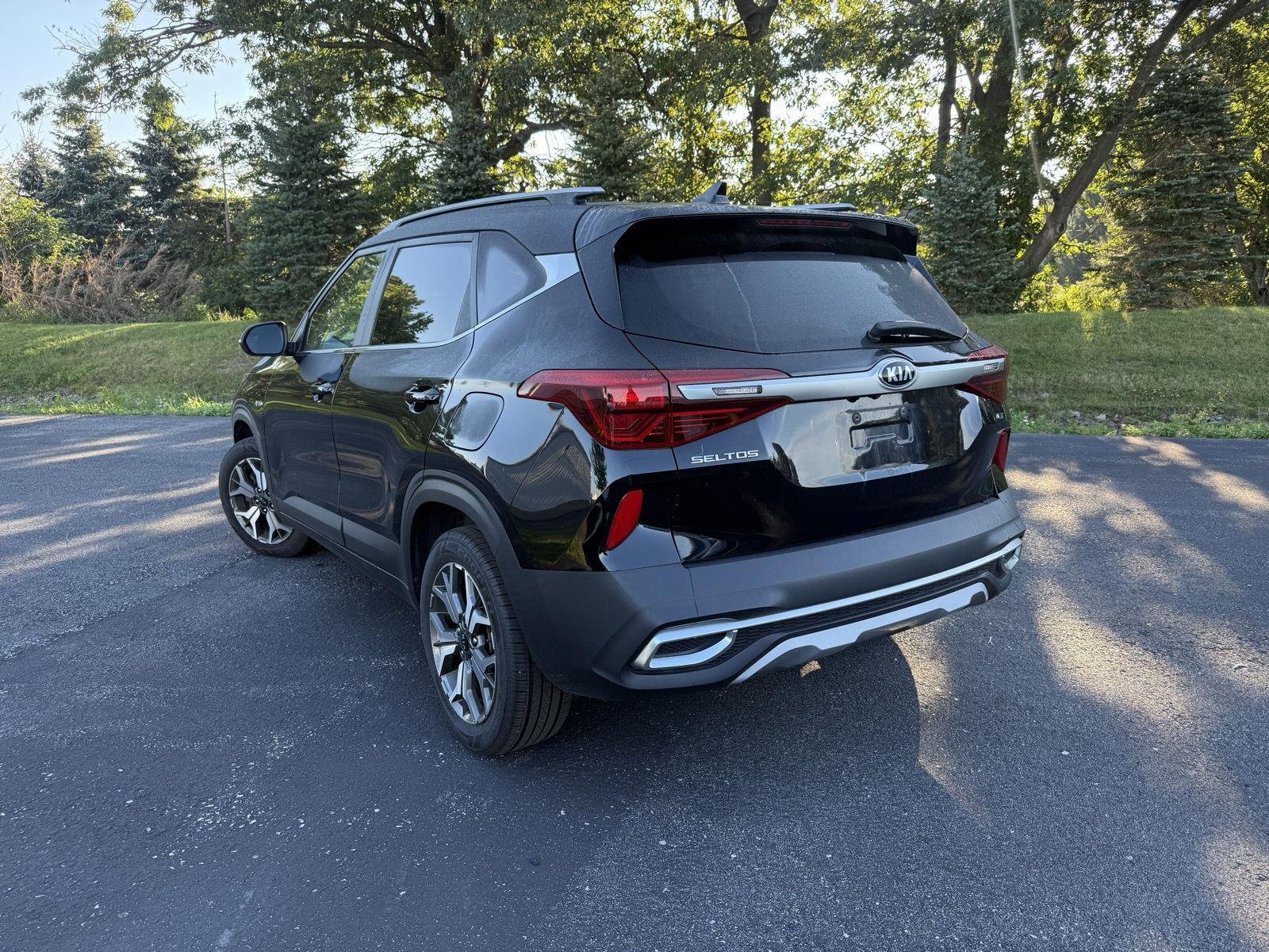 Used 2021 Cherry Black Kia EX image 2