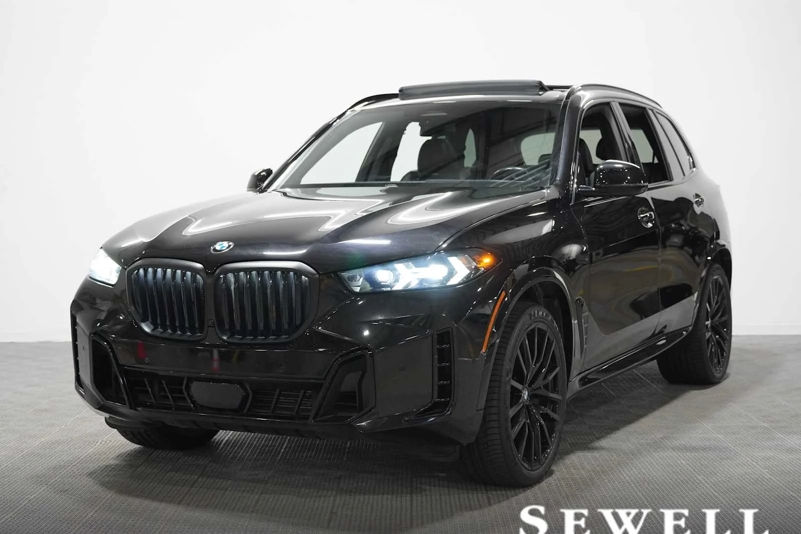 Certified Used 2024 Black Sapphire Metallic BMW sDrive40i image 1