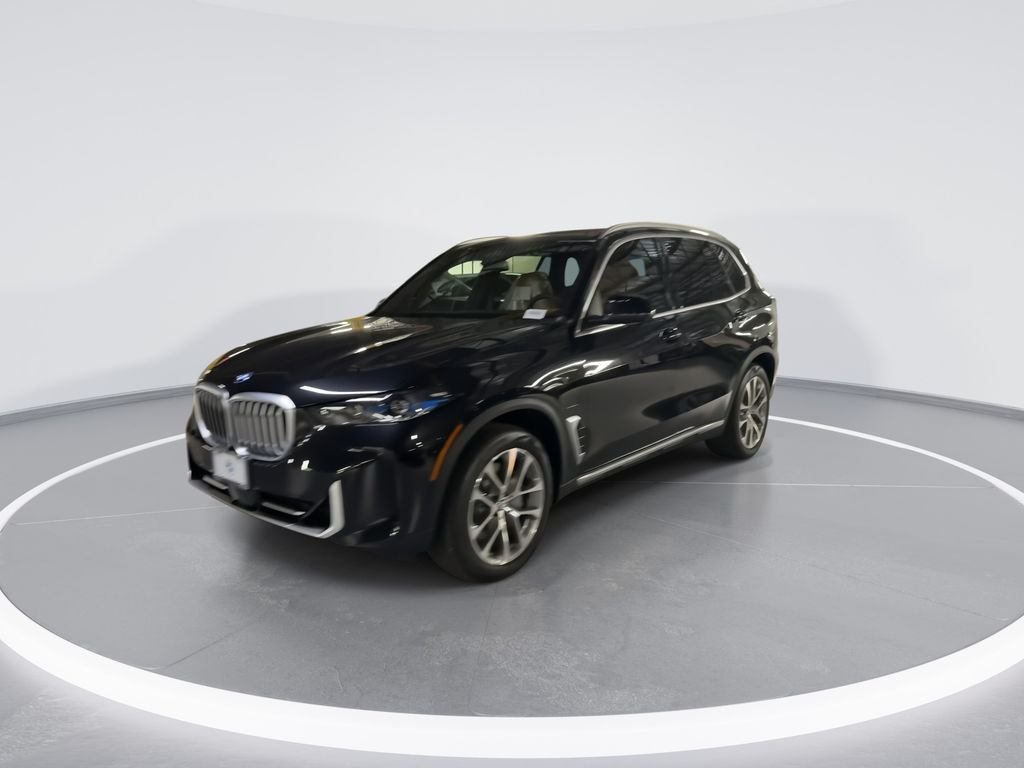 New 2026 Black Sapphire Metallic BMW xDrive50e image 4