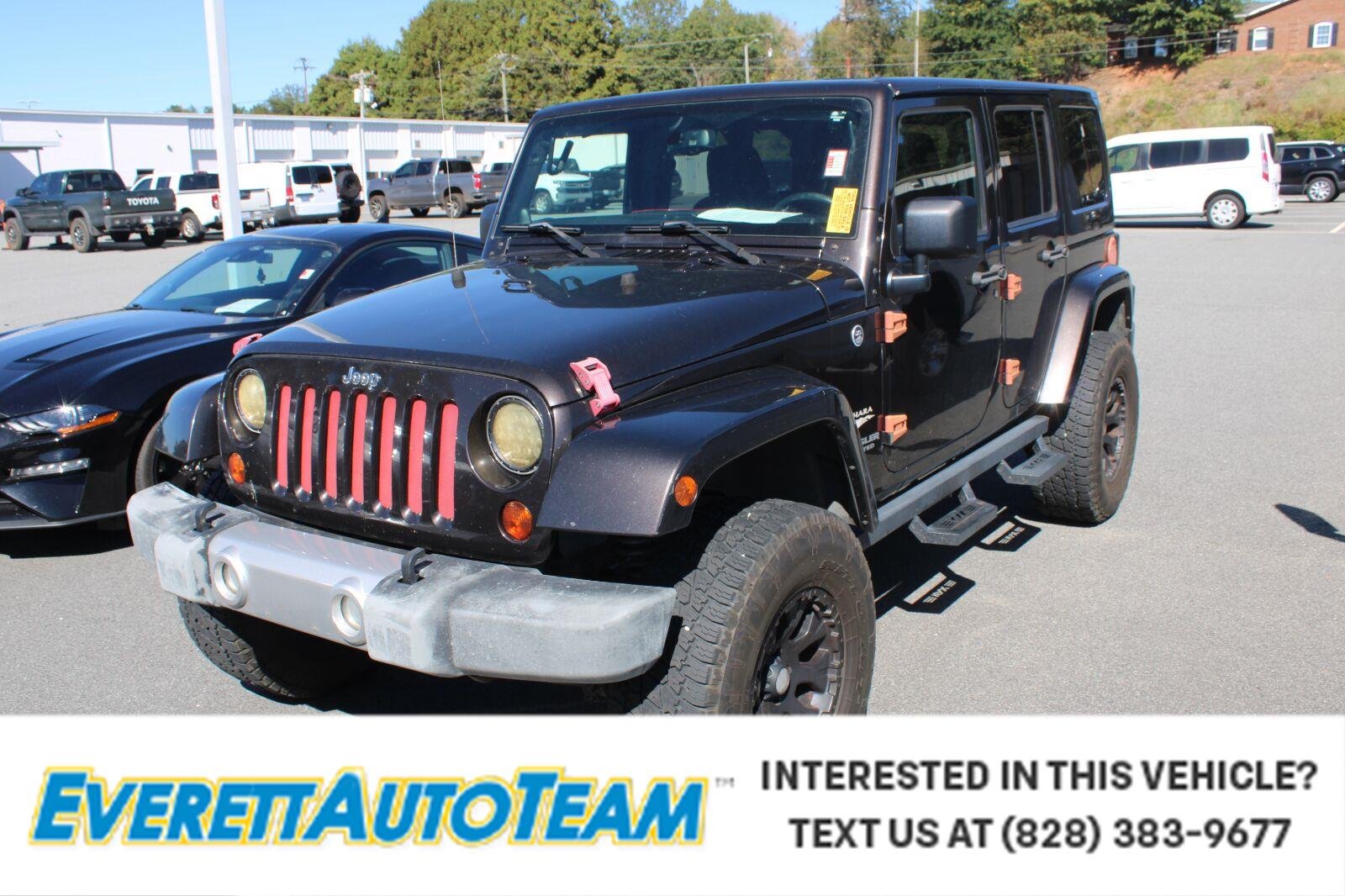 Used 2013 Rugged Brown Pearl Jeep Sahara image 1