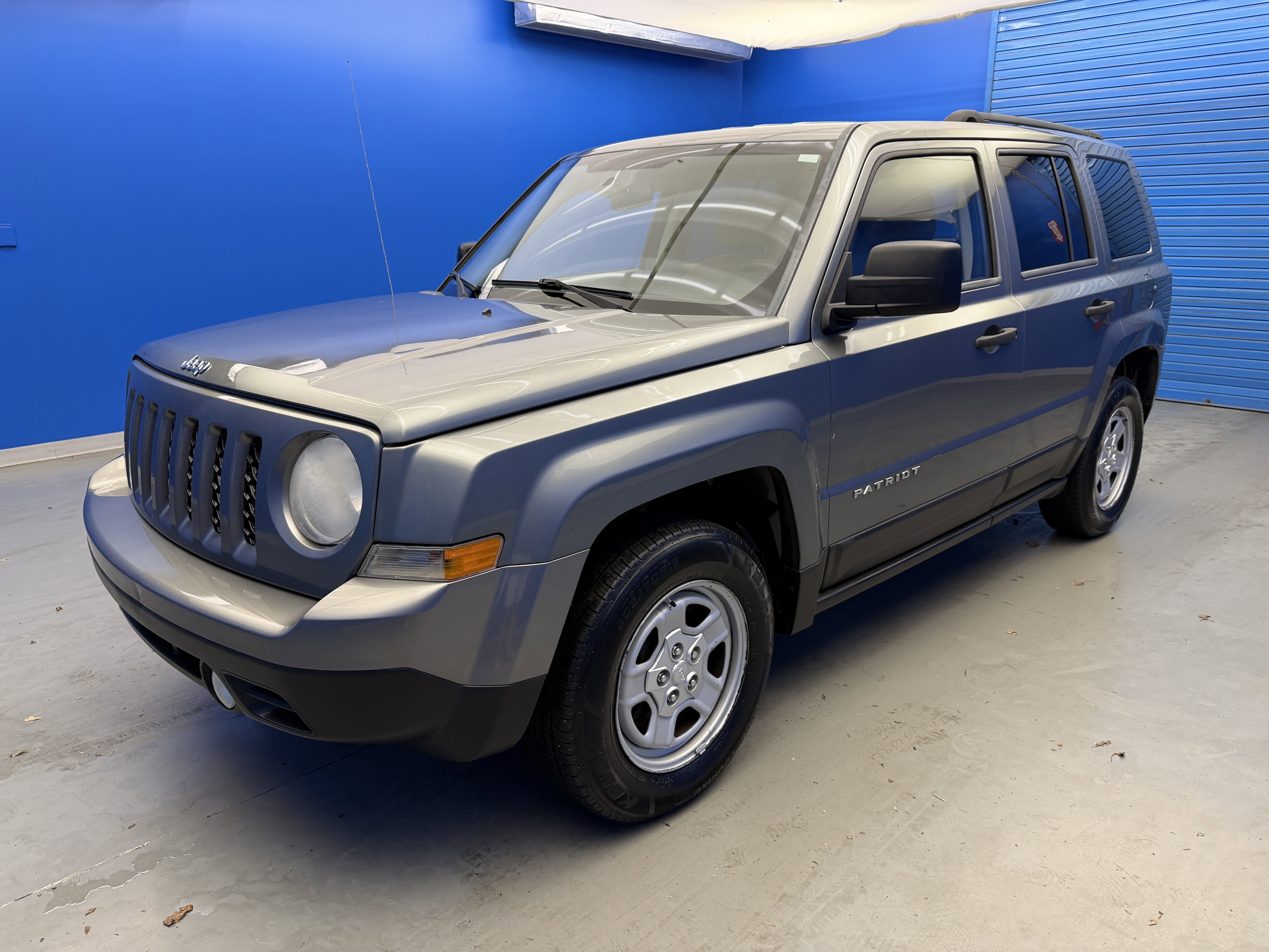 Used 2012 Mineral Gray Metallic Jeep Sport image 4