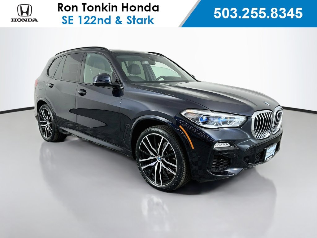 Used 2021 Carbon Black Metallic BMW xDrive40i image 1