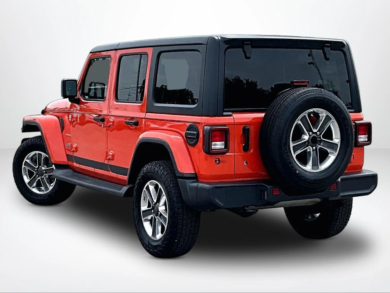 Used 2018 Orange Jeep Unlimited Sahara image 14