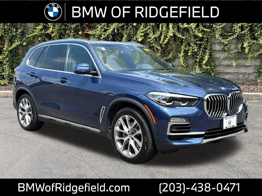 Used 2021 Phytonic Blue Metallic BMW xDrive40i image 1