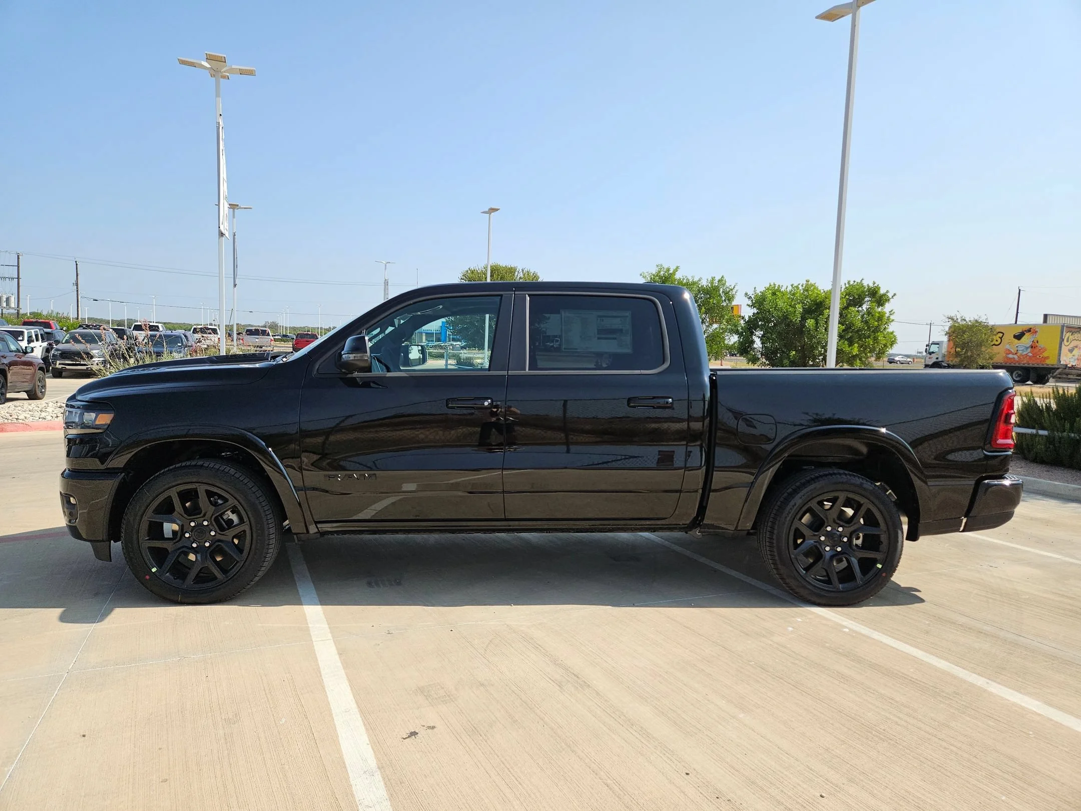 New 2027 Diamond Black Crystal Pearl-Coat Exterior Paint RAM Laramie image 6