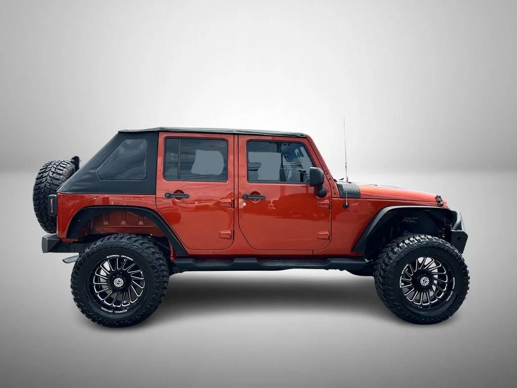 Used 2009 Orange Jeep Unlimited X image 5