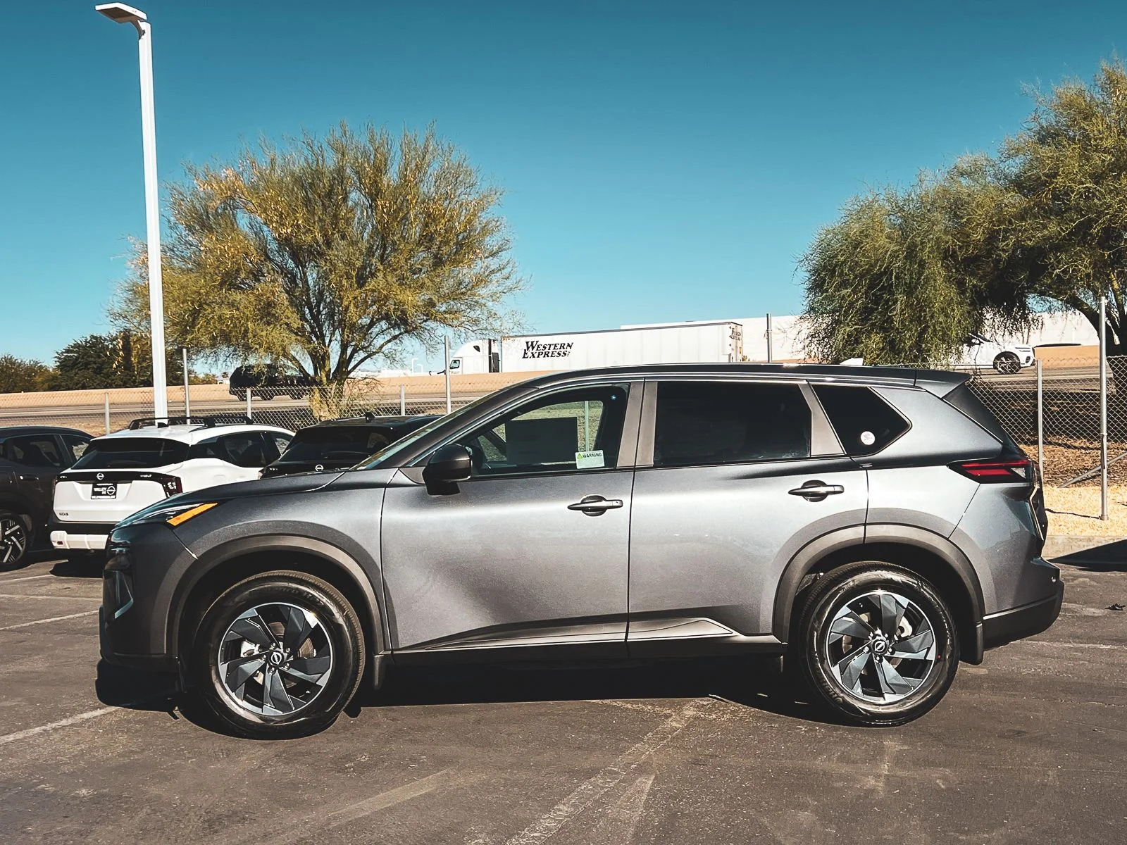 New 2026 Gun Metallic Nissan SV image 8