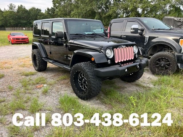 Used 2017 Black Jeep Unlimited Sahara image 1