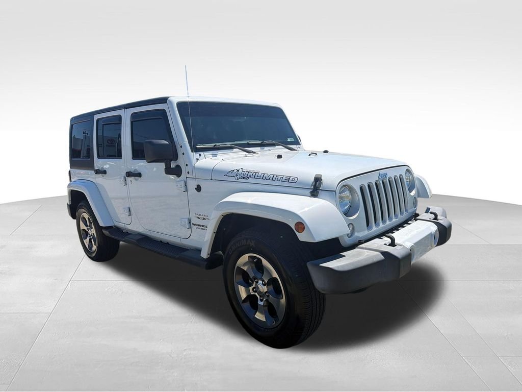 Used 2016 White Jeep Unlimited Sahara image 7