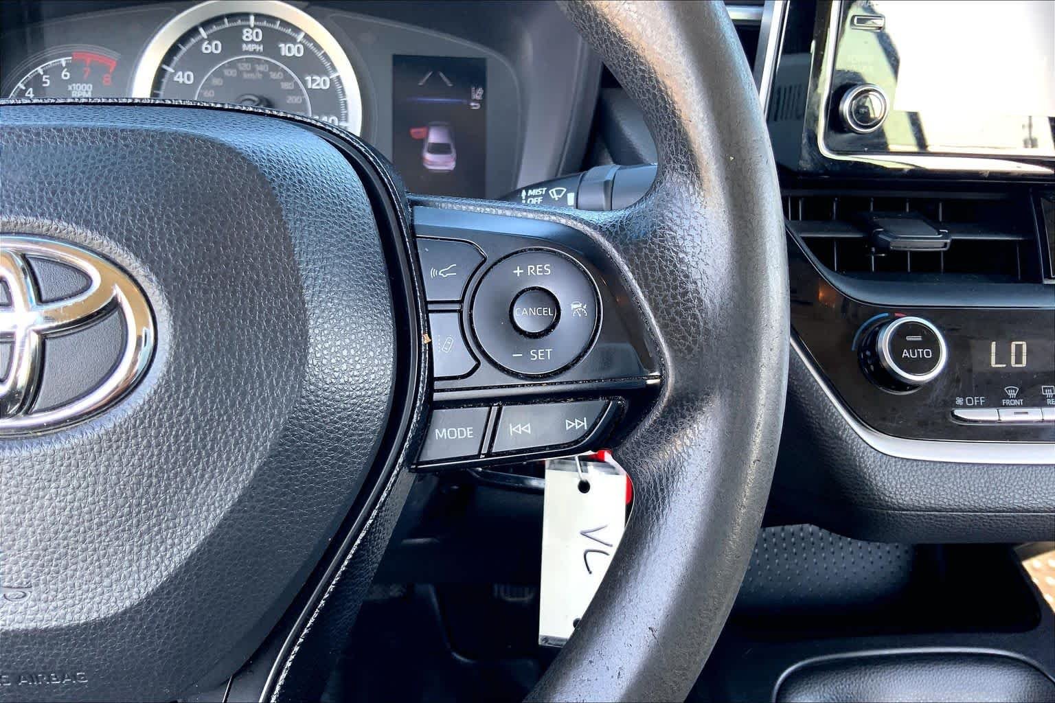 Used 2020 Barcelona Red Metallic Toyota LE image 24