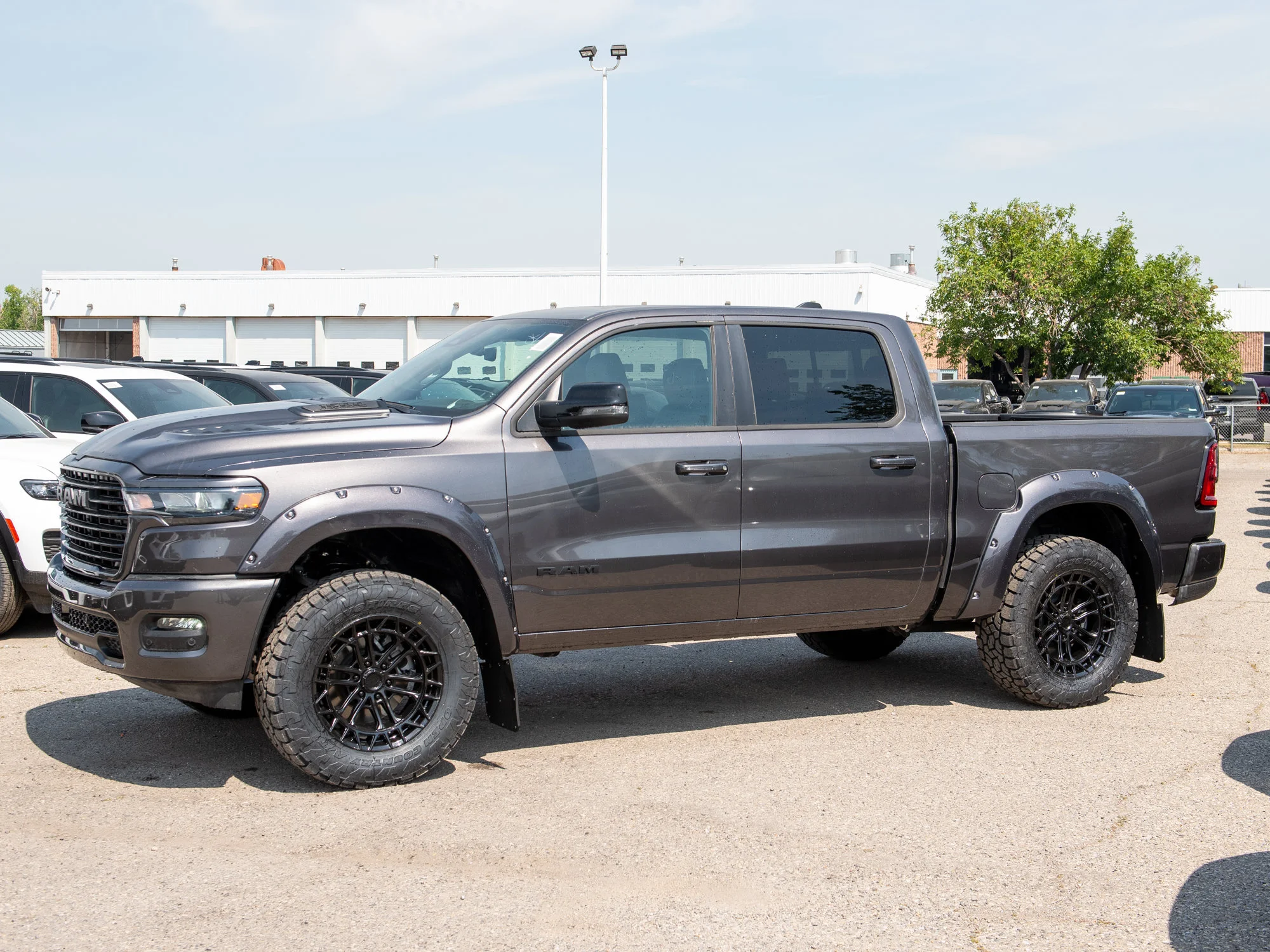 New 2026 Grey RAM Sport* Crew Cab 4x4, 3.5 Inch Lift, 35 Inch Tires, Fuel Wheels, Trigger Industries Mudflaps image 3