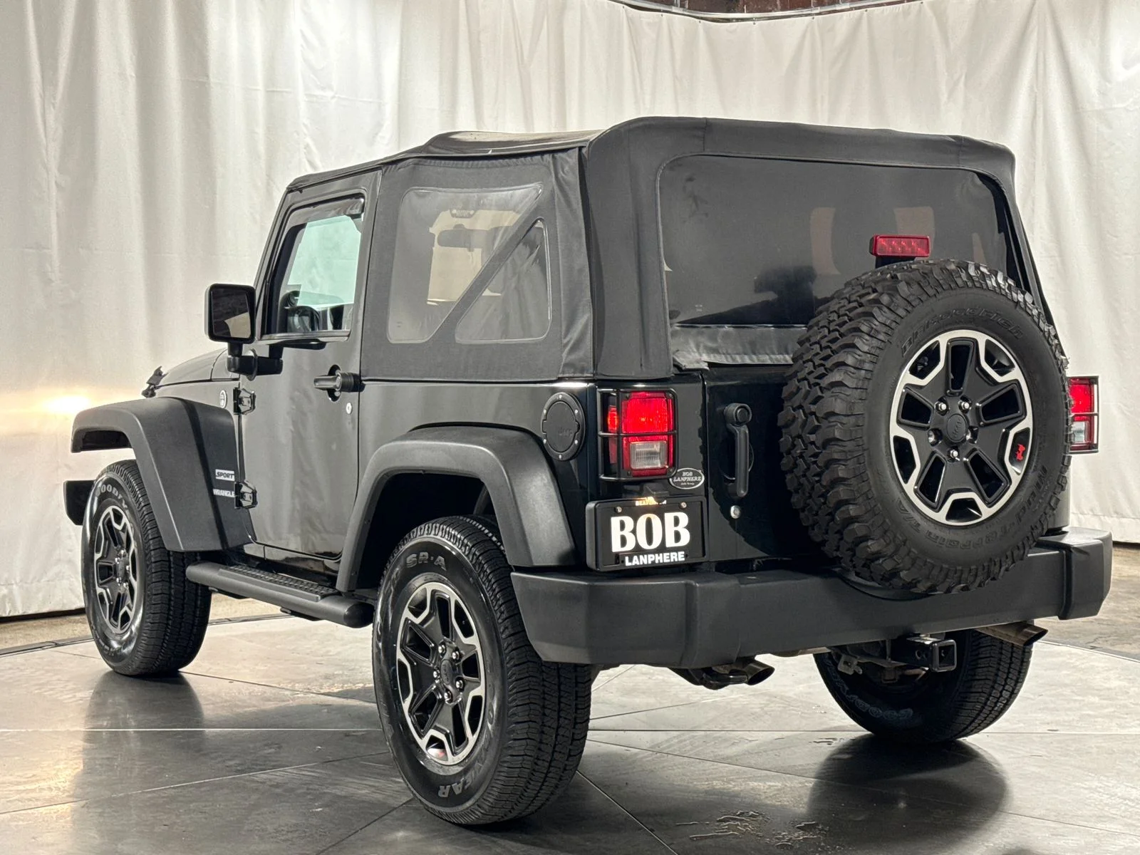 Used 2012 Black / Forest Green Jeep Sport image 9