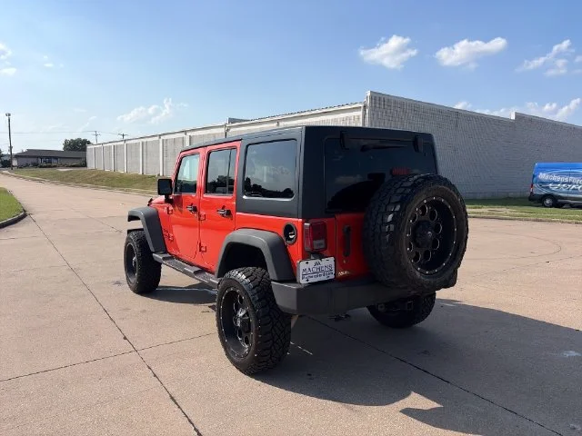 Used 2015 Orange Jeep Unlimited Sport image 3