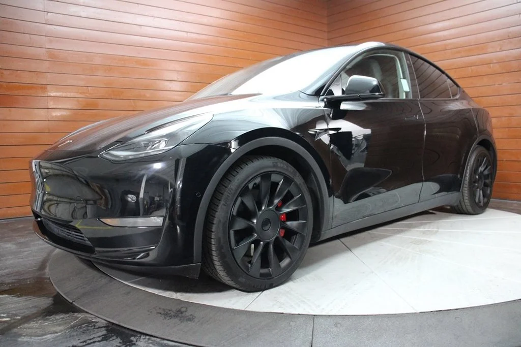 Used 2022 Solid Black Tesla Performance image 1