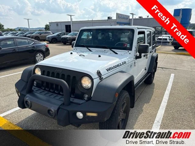Used 2016 White Jeep Unlimited Sport image 1