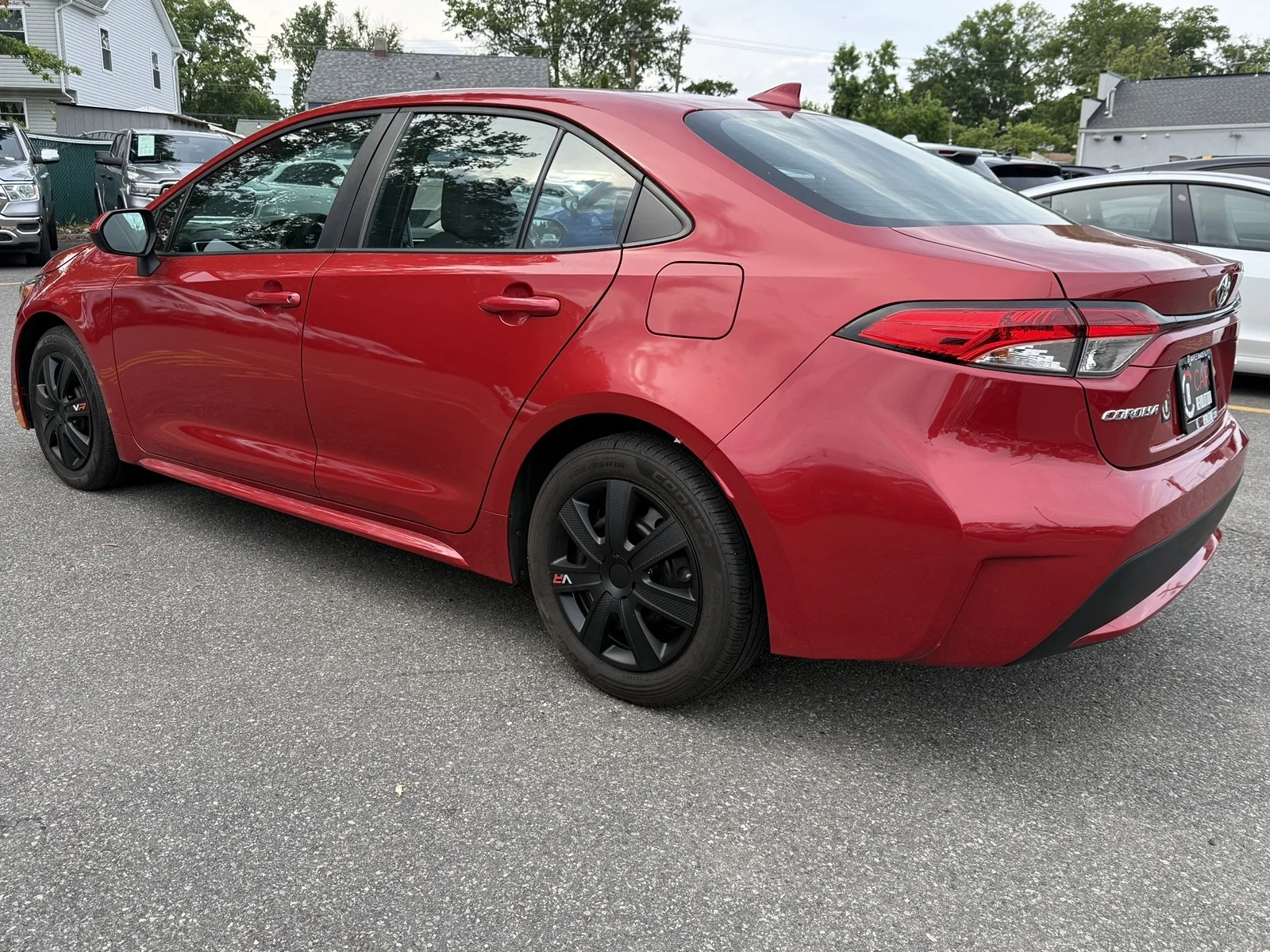 Used 2021 Barcelona Red Metallic Toyota LE image 4