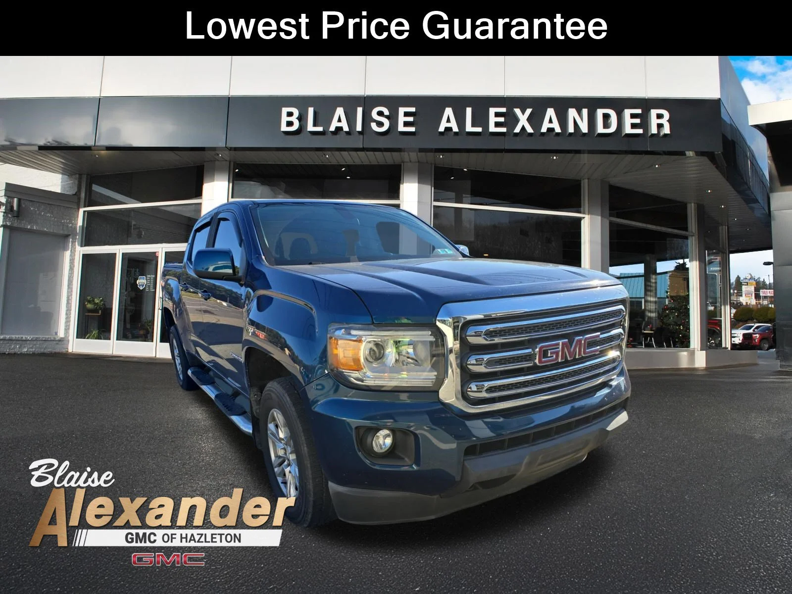 Used 2019 Blue Emerald Metallic GMC 4WD SLE image 1