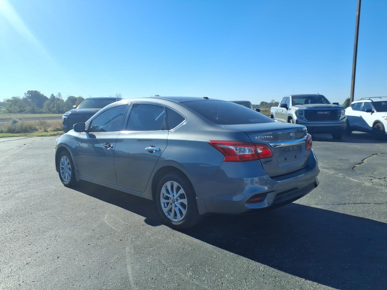 Used 2016 Gun Metallic Nissan SV image 3