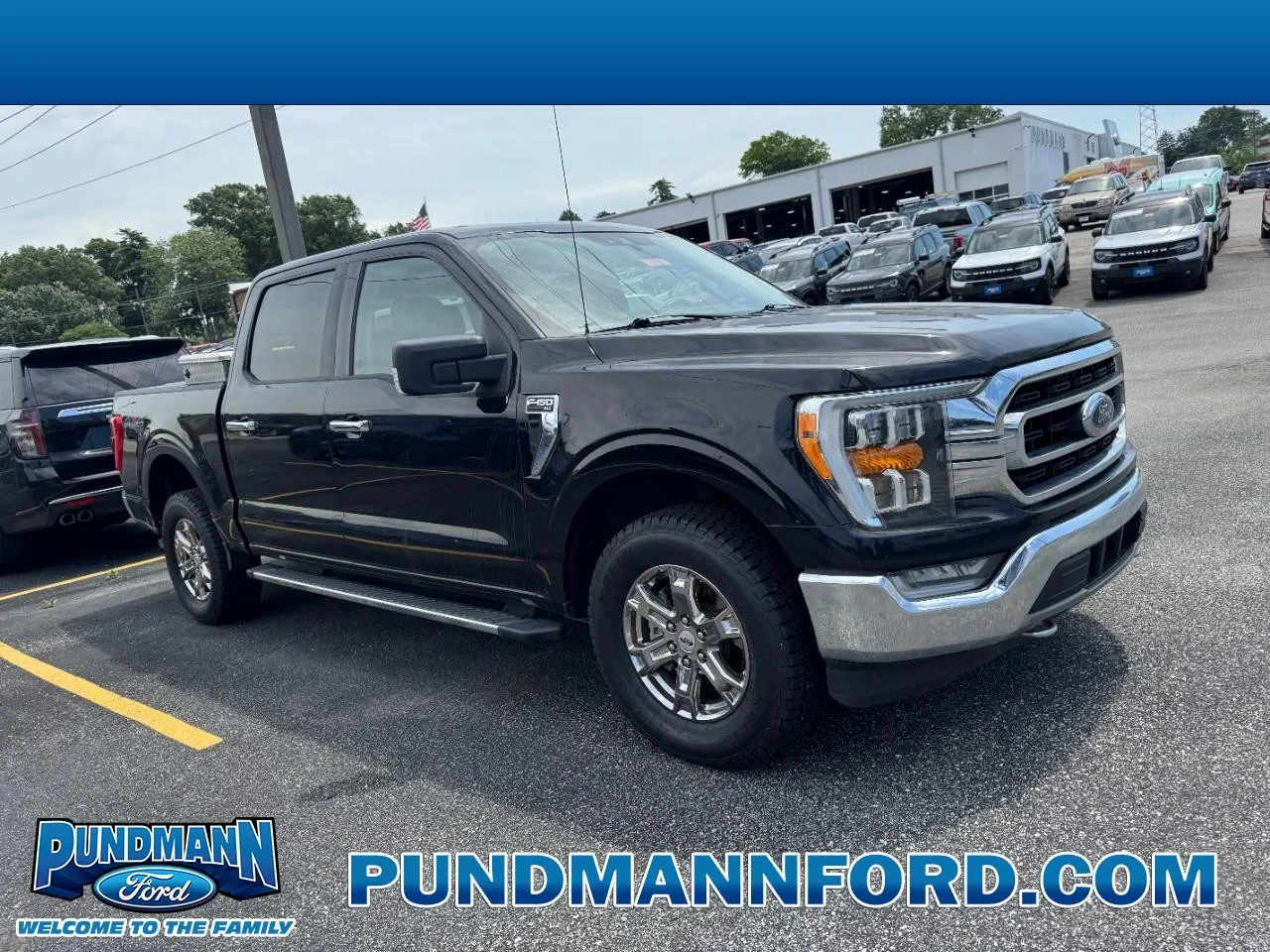 Used 2021 Agate Black Metallic Ford XLT 4WD SuperCrew 5.5' Box image 1