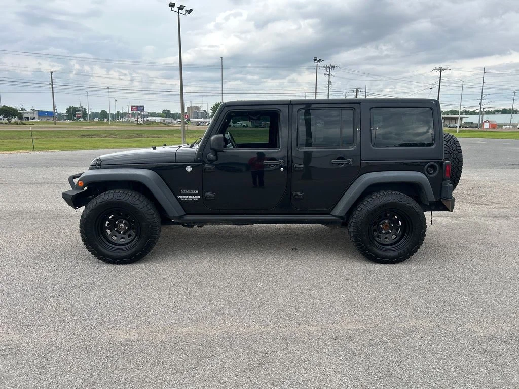 Used 2015 Jeep Wrangler Unlimited Sport with VIN 1C4BJWDG8FL714983 for sale in Dyersburg, TN