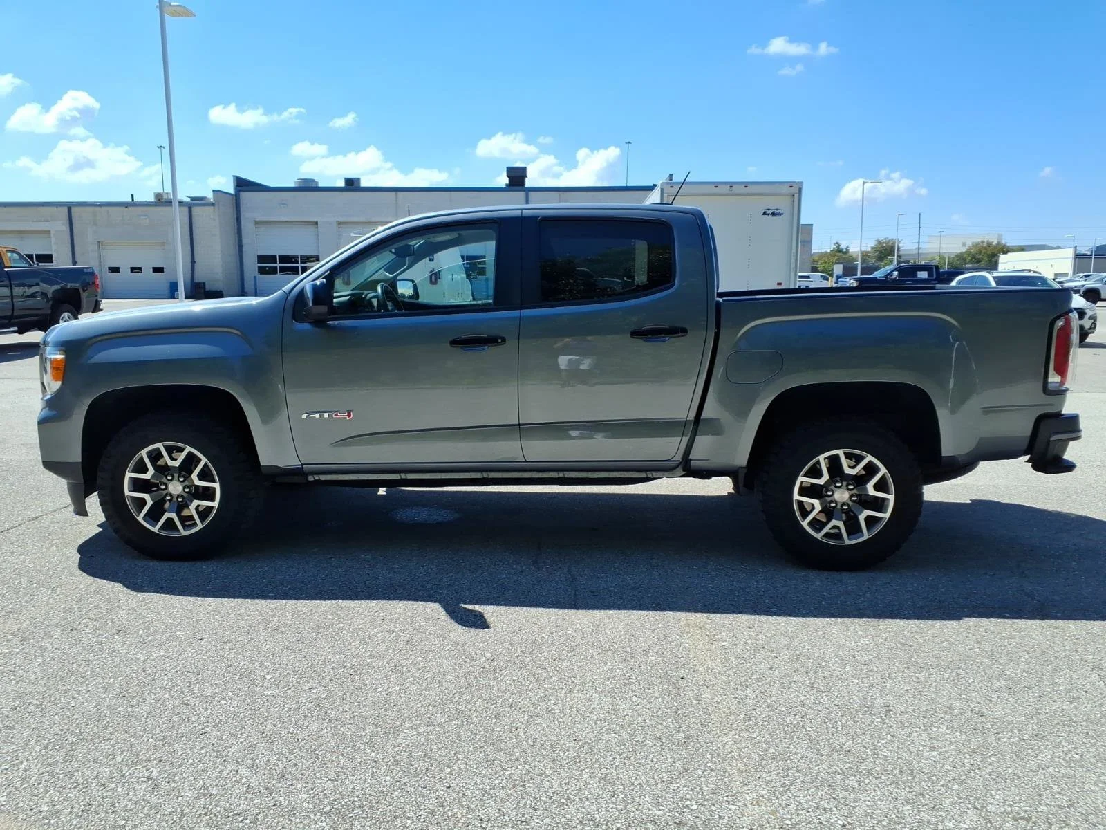 Used 2022 Satin Steel Metallic GMC 4WD AT4 with Leather image 4