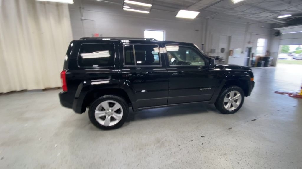 Used 2014 Jeep Patriot Latitude with VIN 1C4NJRFB5ED718580 for sale in Lansing, MI