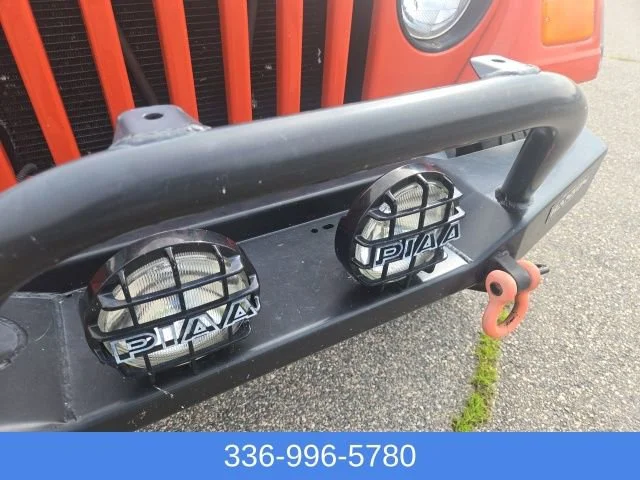Used 2005 Impact Orange Cle Jeep Sport image 9