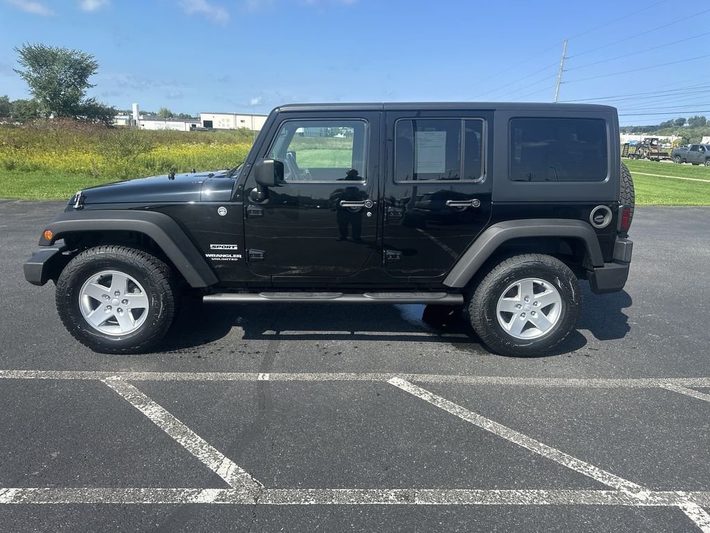 Used 2014 Black Jeep Unlimited Sport image 5