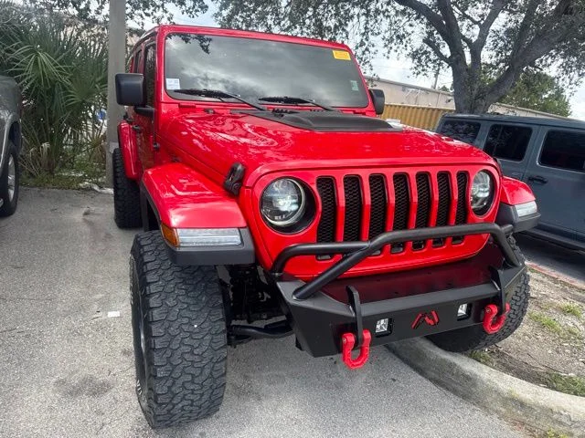 Used 2020 Red Jeep Unlimited Sahara Altitude image 1