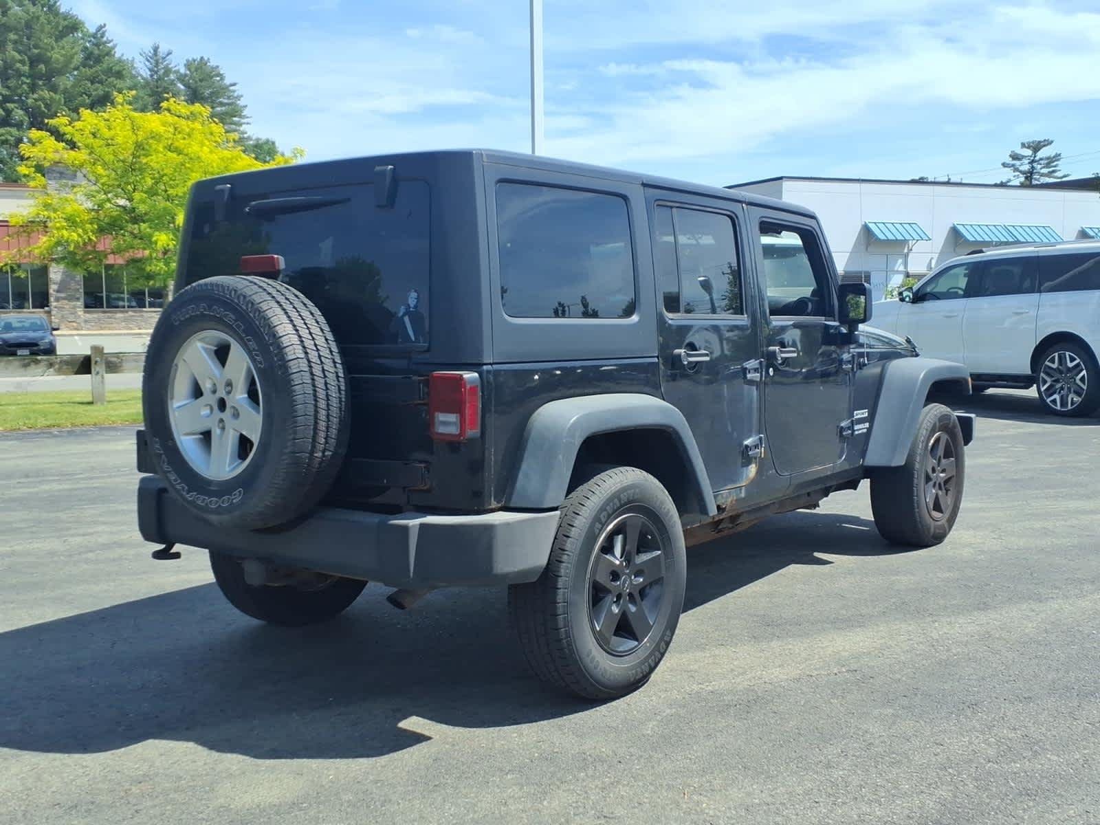Used 2013 Black Clearcoat Jeep Sport image 5