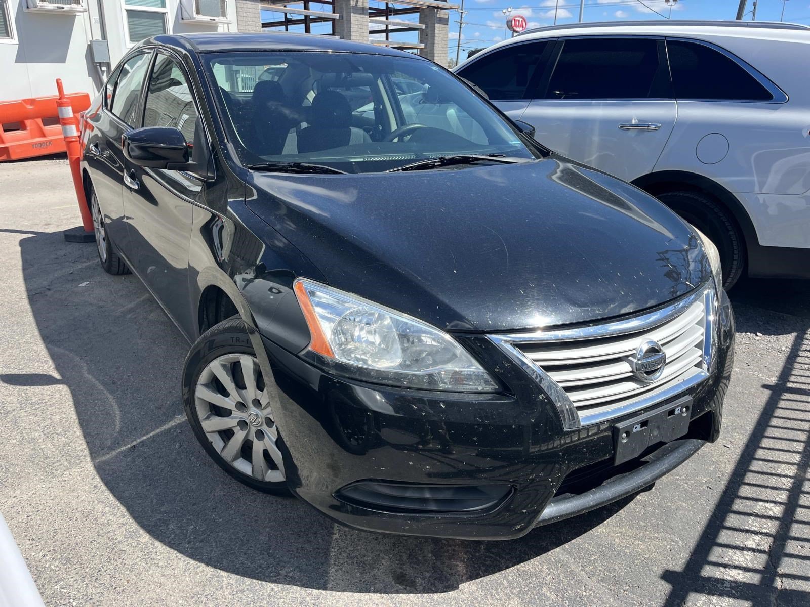 Used 2014 Super Black Nissan SV image 1