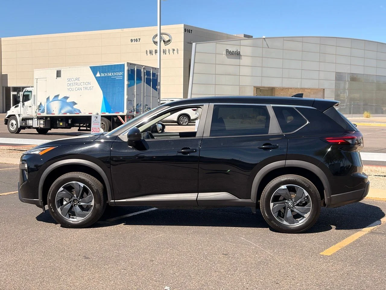 Used 2025 Super Black Nissan SV image 2