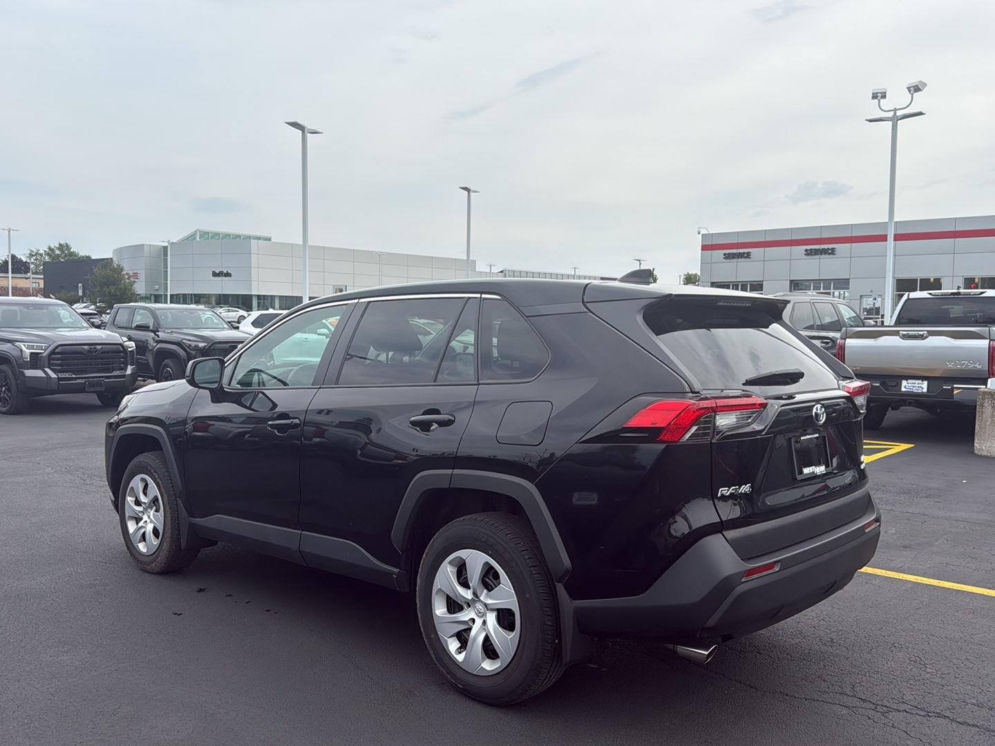 Used 2024 Midnight Black Metallic Toyota LE image 5