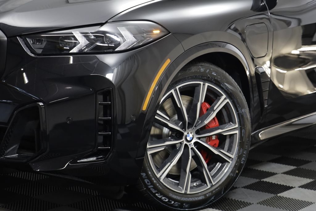 New 2026 Black Sapphire Metallic BMW xDrive50e image 4