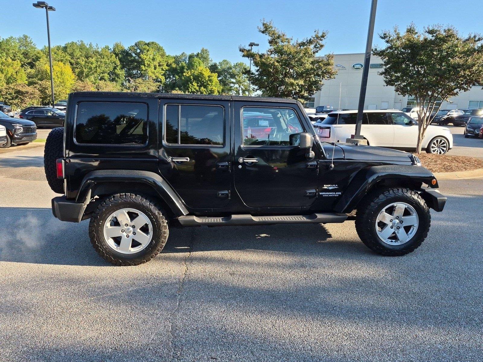 Used 2011 Black Clear Coat Jeep Sahara image 5