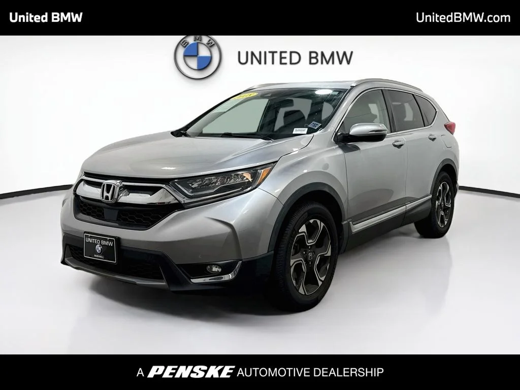 Used 2018 Lunar Silver Metallic Honda Touring image 1