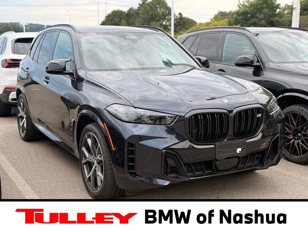 Used 2026 Carbon Black Metallic BMW M60i image 1