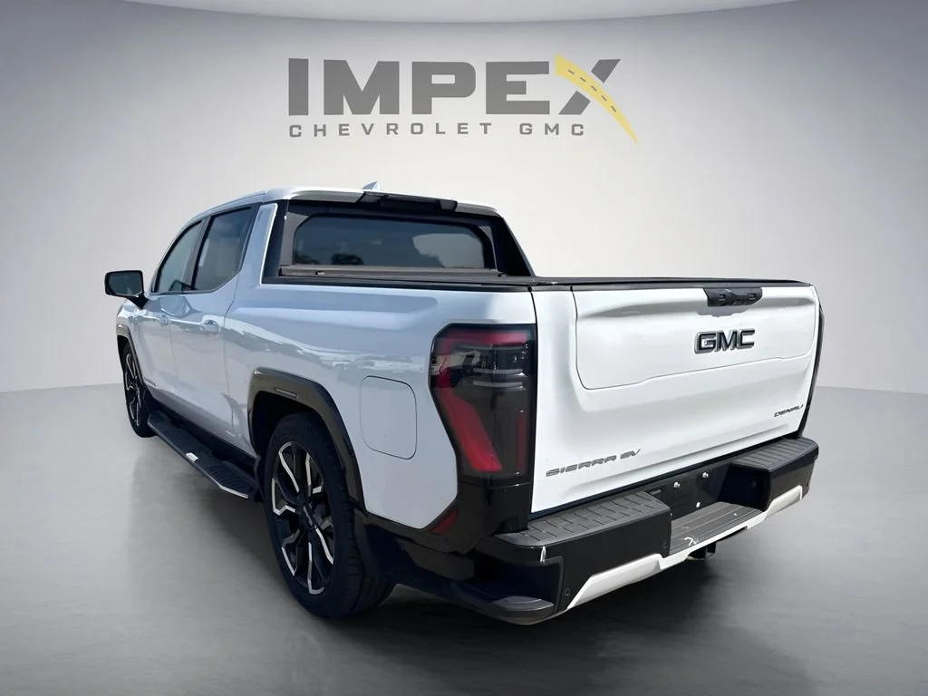 Used 2025 Summit White GMC Max Range Denali image 2
