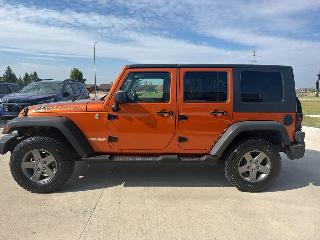 Used 2010 ORANGE Jeep Mountain image 1