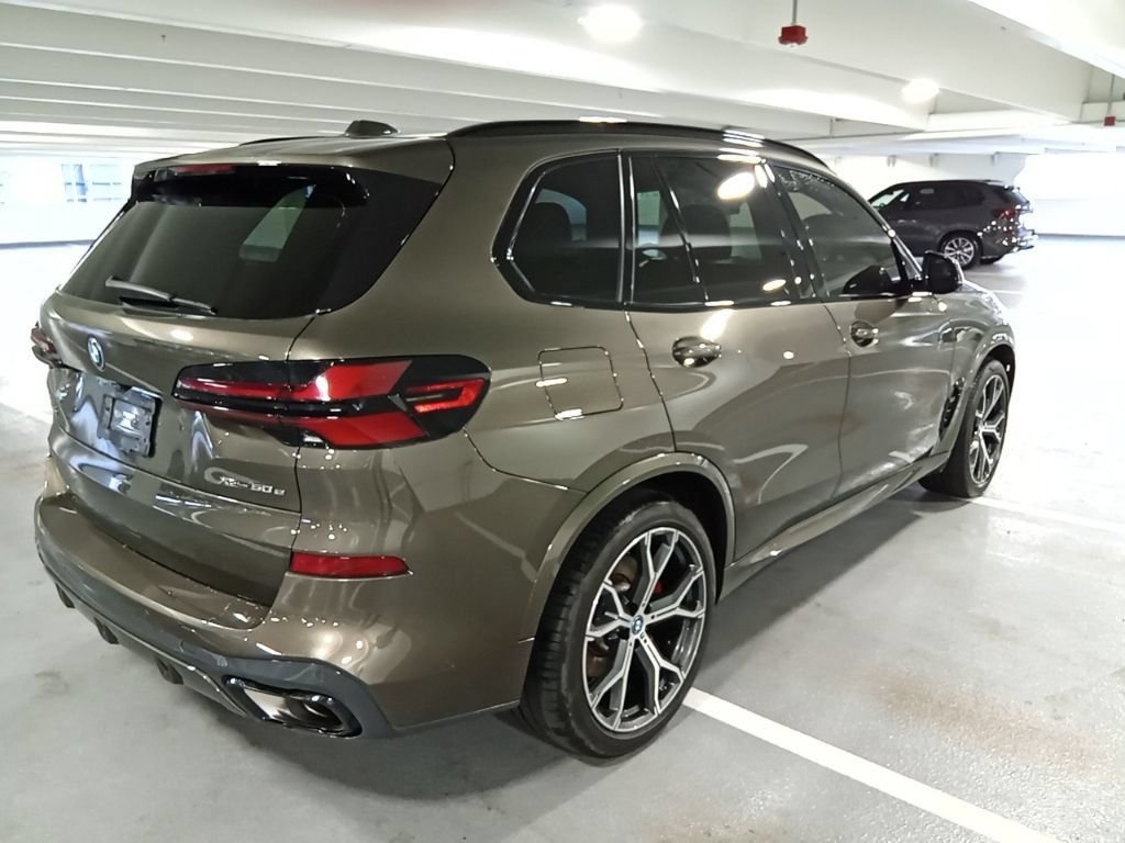 Used 2024 Manhattan Green Metallic BMW xDrive50e image 5