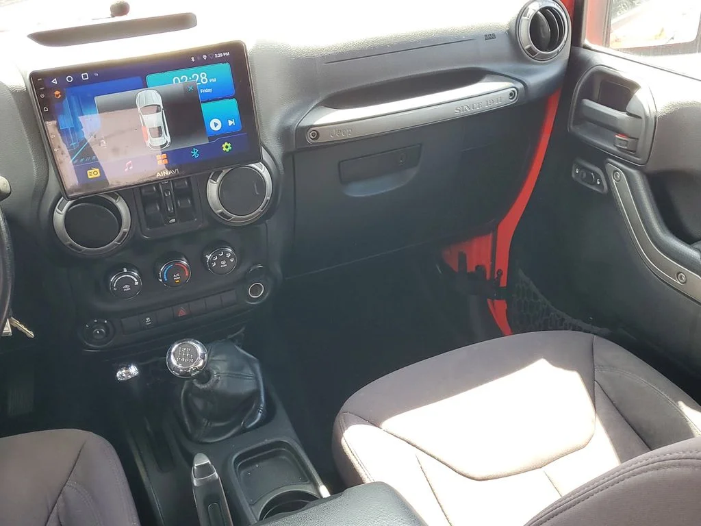 Used 2013 Red Jeep Unlimited Sport image 14