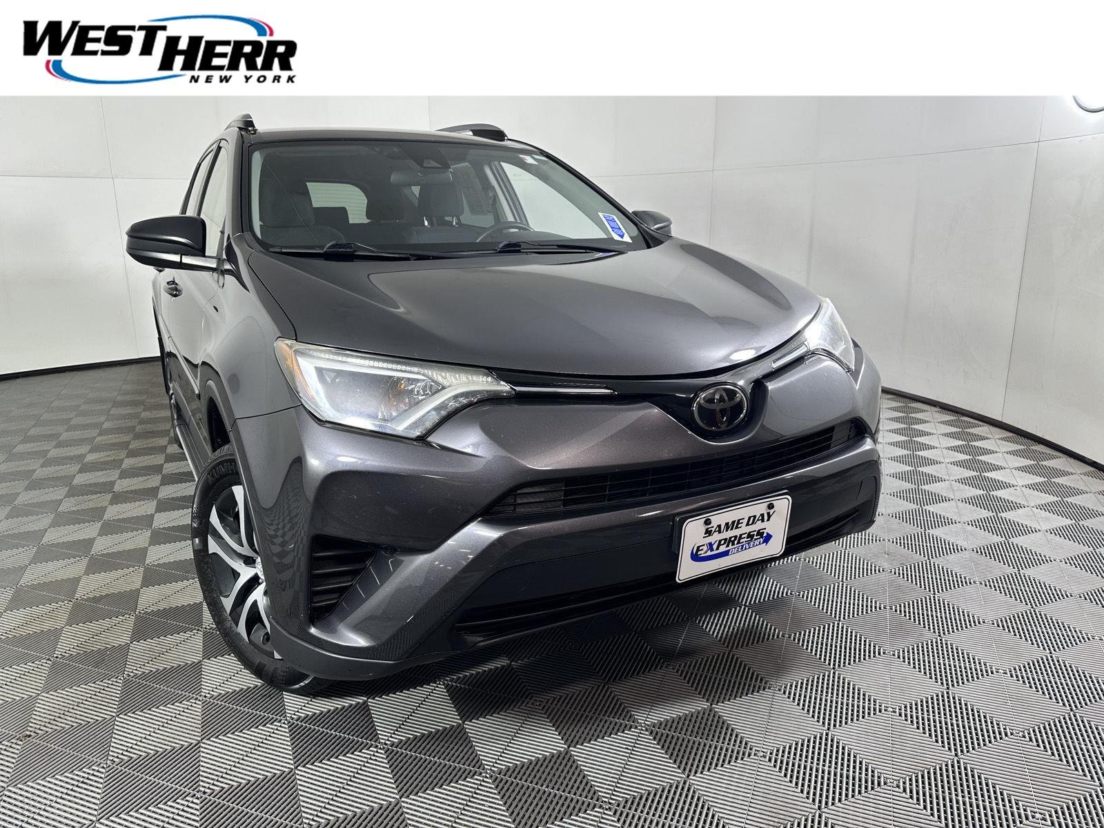 Used 2018 Magnetic Gray Metallic Toyota LE image 1